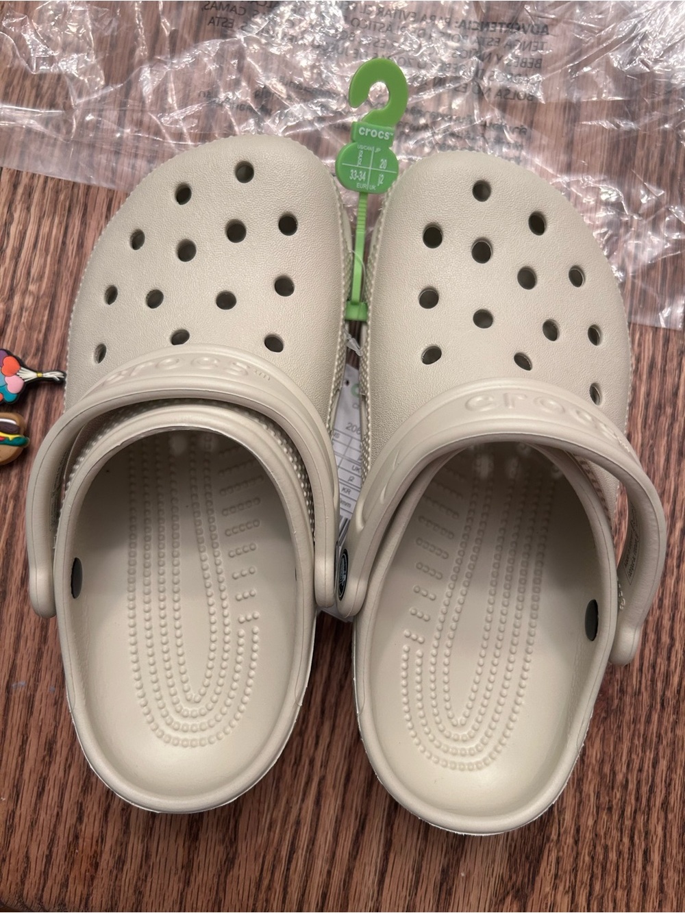 Crocs Kids Classic Clogs in Beige with charms